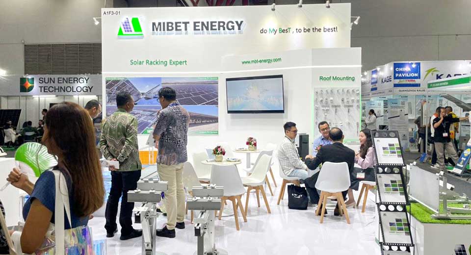 Visitors to the Mibet booth learn about the products